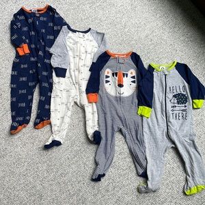 Gerber baby 6-9 month footed pajamas.  Set of 4